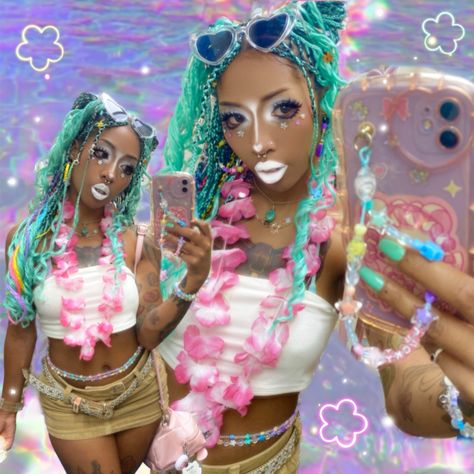 A Black Gyaru aka “Kurogyaru” with mint & rainbow  knotless braids taking a mirror selfie. They are wearing white eye, nose and lips makeup in the “Yamamba” substyle of Gyaru. They are wearing a pink Hawaiian Lei, white tube top, rainbow waist beads, khaki miniskirt with a rainbow bikini underneath. The background is an rainbow iridescent water edit. The photo is edited to portray a tropical core Y2k aesthetic. Beach Gyaru Makeup, Tropic Gyaru, Yamamba Gyaru, Mamba Gyaru, Gyaru Black, Beach Gyaru, Tropical Gyaru, Manba Gyaru, Black Gyaru