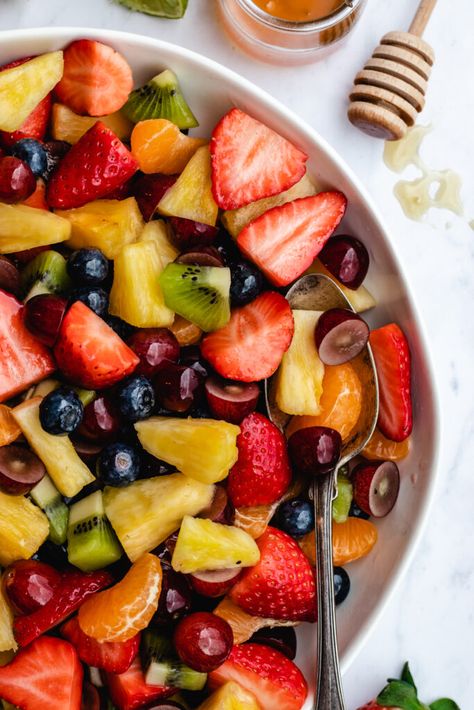 Fruit salad with honey dressing served in a bowl with a jar of honey on the side. Fall Fruit Bowl, Fruit Bowls Ideas, Fruit Salads For Parties, Honey Fruit Salad, Fruit With Honey, Fruit In Jars, Fall Fruit Salad, Fruit Salad With Honey, Fresh Fruit Bowl