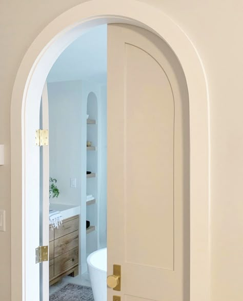 A peek inside the arched doorway to a masterbath with custom vanities and marble floors. Arched Bathroom, Bathroom Door Ideas, Arched Interior Doors, Arched French Doors, Arch Doorway, Arch Interior, Arched Doors, Bathroom Door, Bathroom Doors