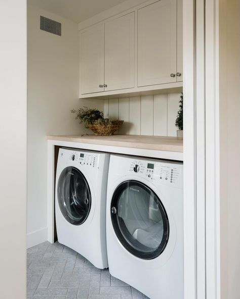 Adding character and charm to this laundry room with a stunning limestone floor tile in a classic herringbone pattern 🤍 #thedendesign_cottage Design by @thedendesigngroup Photos @jessicafixphotography #thedendesign #sonomacountyhome #sonomacountyinteriordesigner #laundryroomdesign #laundryroom #tileflooringdesign #herringbonetilefloor Herring Bone Tile Floor, Cottage Style Laundry Room, White Oak Countertop, Greige Cabinets, Oak Countertop, Room Floor Tiles, Landry Room, Limestone Floor, Laundry Room Tile