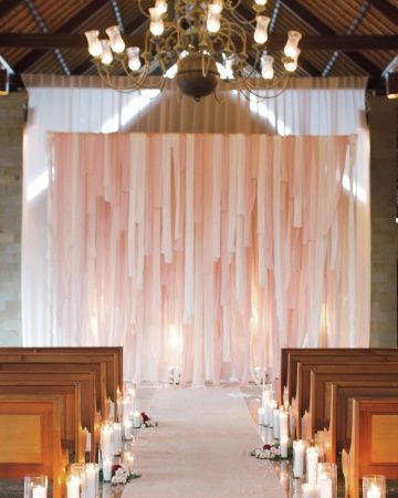 Flowers, candles, and fabric strips transformed this spare ceremony space. Dark or generic church for your ceremony? DIY it to spruce it up! Ribbon Backdrop, Boda Diy, Hunting Party, Wedding Ceremony Backdrop, Bali Wedding, Favor Ideas, Peach Wedding, Martha Stewart Weddings, Wedding Ribbon