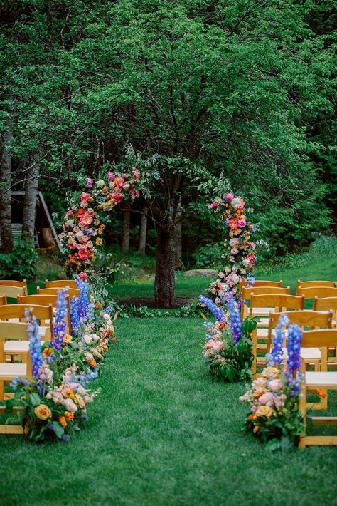 Love bright wedding florals? | Vermont Weddings | Explore the colorful wedding flowers in this intimate castle wedding. Get inspiration for a wedding flower arch, wedding flower bouquets and floral table settings for your wedding here: https://vermontweddings.com/blog/castle-wedding-vermont/ Wildflower Wedding Theme, Turkey Wedding, Floral Arch Wedding, Colorful Wedding Flowers, Wedding Ceremony Arch, Eclectic Wedding, Wedding Arch Flowers, Vermont Wedding, Arch Flowers