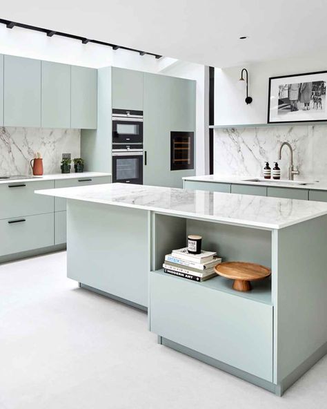 This fresh mint-green kitchen is the epitome of modern design featuring high-tech appliances and smooth green cupboards, thoughtfully designed to elevate culinary experiences! #scandikitchen #homeinspo #luxurykitchens https://www.solakitchens.com/serene-green/ Sea Foam Blue Kitchen, Elegant Kitchen Design Modern, Pastel Kitchen Ideas, Dekton Bergen, Green Cupboards, Mint Green Kitchen, Scandi Kitchen, Black Window Frames, Off White Kitchens