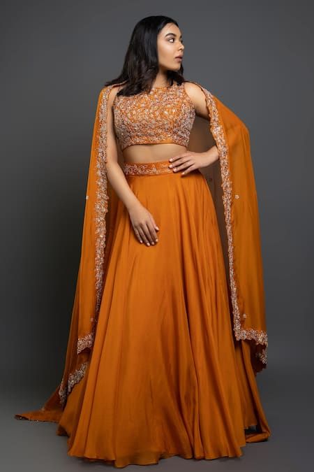 Buy Orange Raw Silk Embroidered Floral Motifs Round Flared Lehenga Set For Women by Shahmeen Husain Online at Aza Fashions.