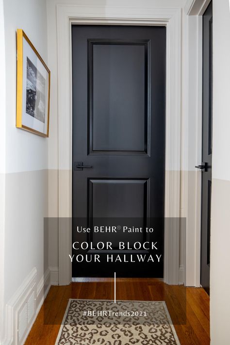 Color blocking a small hallway makes it feel wider due to the horizontal lines created. The best black paint color for interior doors. #BEHR #BEHRTrends2021 #21DaysOfColor Door Color: BEHR Broadway (PPU18-20). Bottom Half of wall: BEHR Almond Wisp (PPU5-12). Top half of wall BEHR Smoky White (BWC-13). #TheHomeDepot. Head over to The Home Depot or go their website for your next paint project. Black Doors Behr Broadway Paint Interiors, Home Depot Front Door Paint Colors, Best Black Behr Paint, Best Black Paint Color Behr, Best Black Behr Paint For Interior Doors, Behr Paint Colors Black, Behr Broadway Paint, Behr Almond Wisp, Behr Smoky White