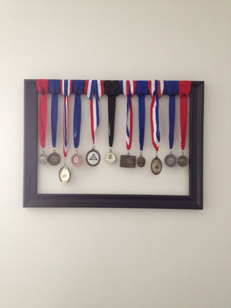 Ways to display medals Display Medals And Ribbons, How To Hang Medals Display Ideas, Ways To Display Medals, Hanging Medals Ideas, How To Display Medals, Medals Display Ideas, Medal Display Ideas, Display Medals, Awards Display