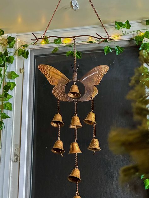 Butterfly with Bells Wind Chime Enjoy the song of lovely bells each time a breeze blows. Our Flamed Butterfly Wind Chimes feature a lovely, sculpted profile, plus soft, iridescent colors that catch the light without overpowering the senses. Nine diminutive bells cascade throughout the piece, provide a pleasing sound. Like other Happy Gardens wind chimes, this set has been individually handcrafted, and will bring lasting beauty to your patio, porch, or garden. 9 bells Dimensions: 10.5” L x 1.5” W Cool Wind Chimes, Wind Chimes Aesthetic, Windchimes Outdoor, Bug Decor, Trinkets Decor, Bell Wind Chimes, Butterfly Wind Chime, Unique Wind Chime, Wind Bell