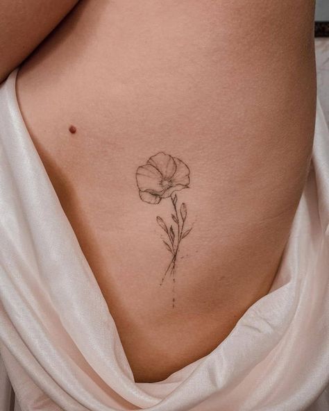 Feminine Tiny Poppy Flower Tattoo Poppy Stencil Tattoo, Common Poppy Tattoo, Poppy Behind The Ear Tattoo, Poppy Tattoo On Ribs, 3 Poppy Flower Tattoo, Delicate Poppy Flower Tattoo, Four Flower Tattoo, Poppy Micro Tattoo, Blooming Poppy Tattoo