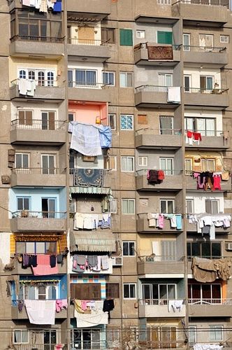 By Petr Svarc// idea de comunas o casas de interes social con tendencias de neoplaticismo Stinky Towels, Smelly Laundry, Balcony Art, Clothes Lines, Life In Egypt, Apartment Block, Clothes Hanging, Old Egypt, Laundry Drying