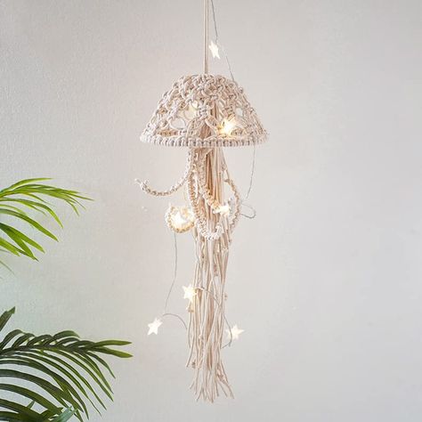 PRICES MAY VARY. HANDMADE JELLYFISH : The jellyfish macrame wall hanging are made of 100% natural cotton rope. It was woven by craftsmen for many years, real like delicate in details. A perfect handmade wall ocean decor. Size: 55 x 20 cm / 21.7 x 7.9 in. UNIQUE WALL DECOR: Unique design, jellyfish after hours of knotting, meticulously handcrafted, using materials giving a minimalist feel and creating a relaxed feel in the room. Also perfect for theme room decor or seaside hotel / office / studio Tapestry Macrame, Coastal Nursery, Beach Nursery, Sea Nursery, Ocean Room, Beachy Room, Mermaid Room, Ocean Nursery, Living Room Nursery