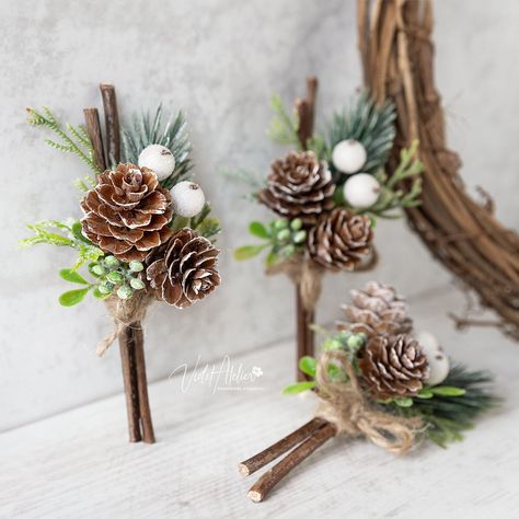 "Winter wedding boutonniere designed for winter lovers and mountain weddings, making it a perfect fit for your woodland wedding celebration. A pretty alternative to the wedding flowers for the groom and ideal wedding accessories for the father of the bride, father of the groom, groomsmen, and all the important men on your Big Day. Each piece features artificial cedar and pine tree greenery, frosted berries, small natural pine cones and wooden sticks, all wrapped in twine, providing a rustic feel Winter Wedding Plate Setting, Winter Wedding Corsage, Pine Wedding Bouquet, Winter Wedding Snacks, Pine Cone Wedding Decorations, Winter Wedding Bouquet Evergreen, Mountain Wedding Bouquet, Winter Wedding Boutonniere, Groomsmen Flowers