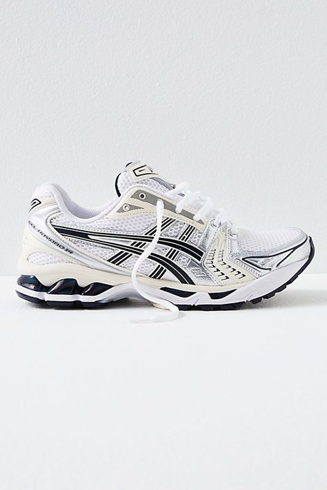 Inspired by your favorite trainers from the early 2000s, these sporty sneakers from Asics combine vibrant gel details with performance technology you know and love. **Features:** Low-boot construction, mesh and leather layered uppers, gel midsole cushioning, vibrant tooling details, rubber outsole, secure lace closure **Why We | Gel-kayano 14 Trainers Shoe by ASICS at Free People in White/Midnight, Size: US 8 Cool Trainers Women, Gel Asics Outfit, Gel Kayano Asics Outfit, Acisis Shoes, Asics Shoes Outfit, Asics Outfit Black Woman, Asics Aesthetic, Asics Kayano, White Asics