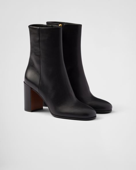 These leather booties have a sleek, refined design and a versatile character. Prada Black Boots, Short Prada Boots, Prada Boots, Ballerina Slippers, Mens Travel Bag, Concert Fits, Fancy Shoes, Airport Fashion, Prada Leather