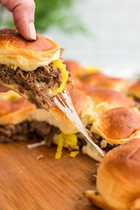 Mississippi pot roast sliders are stuffed with tender cooked chuck roast, tangy pepperoncini peppers, and melty provolone cheese tucked inside sweet Hawaiian rolls. Roast Sliders, Pot Roast Sliders, Tender Chuck Roast, Sweet Hawaiian Rolls, Leftover Pot Roast, Pork Crockpot Recipes, Mississippi Roast, Pepperoncini Peppers, Mississippi Pot Roast