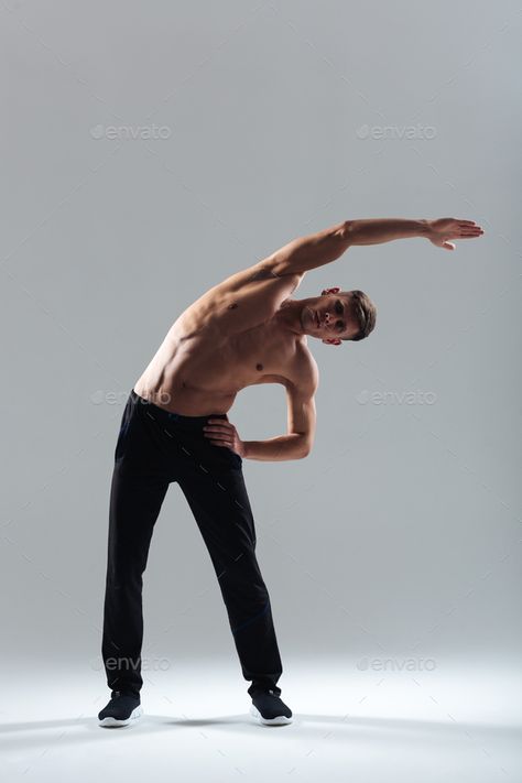 Fitness man doing stretching exercises by vadymvdrobot. Full length portrait of a fitness man doing stretching exercises over gray background#exercises, #vadymvdrobot, #stretching, #Fitness Stretching Poses Reference Male, Yawn Stretch Pose, Man Stretching Drawing Reference, Full Body Poses Drawing Men, Male Stretching Pose Reference, Man Stretching Reference, Stretching Poses Reference Drawing, Stretching Reference Drawing, Person Stretching Reference