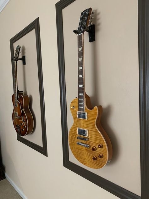 Wall Mounted Guitars, Wall Mounted Guitar Ideas, Framed Guitars On Wall, Guitar Mounted On Wall Decor, Guitar Mounted On Wall, Display Guitars On Wall, Guitar Wall Mount Ideas, Guitars On Wall Living Room, Guitar Hanging On Wall