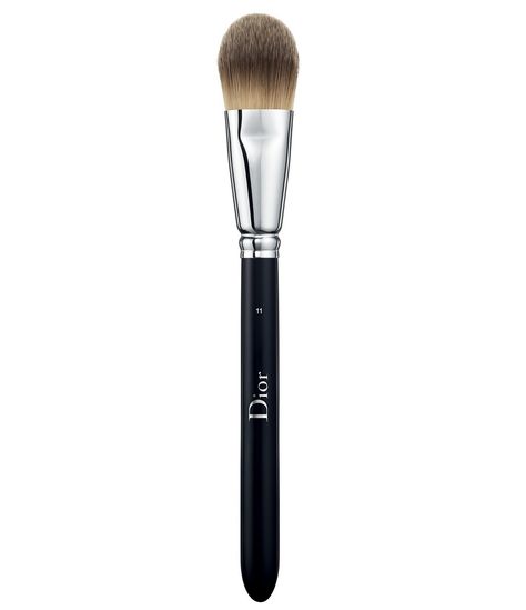 Drawing inspiration from backstage Dior runway shows, the light coverage fluid foundation brush No. 11 is designed for perfect, simple makeup application. It is your foundation's best ally for a light coverage effect. This brush delivers seamless application with a second-skin finish and build-able light to medium coverage. Designed for use with fluid and cream foundation, it has a tapered, layered "cat's to Makeup Foundation Brush, Dior Foundation, Dior Runway, Maybelline Falsies, Makeup Color Wheel, Dior Backstage, Brush Cleanser, Cream Foundation, Shower Skin Care