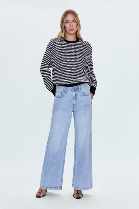 Medium weight, chenille knit sweater. Raglan, long sleeves with contrast rib trim at neckline, sleeves, and hem. Designed with an elongated crop proportion and split hem that grazes the waistband. 100% Cotton Imported Split Hem, Medium Weight, Knit Sweater, Split, Trim