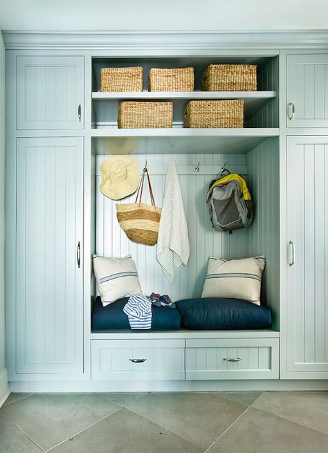 Beautiful mudroom with duck egg blue cabinets accented with beadboard trim flanking floating shelving unit over built-in bench with storage drawers Laundry Addition, Beadboard Mudroom, Coastal Mudroom, Beautiful Mudroom, Coastal Closet, Beadboard Cabinets, Hall Unit, Blue Beadboard, Cottage Laundry