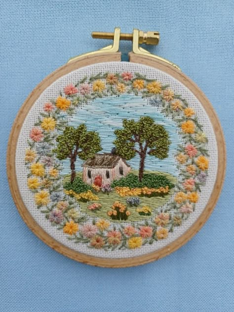 Detailed hand embroidered cottage and flower landscape. flower border/vintage colours/cottage/embroidery decor/art/thread art/ www.Etsy.com/shop/frenchknotcreations Village Embroidery, Cottage Embroidery, Embroidered Cottage, Embroidered House, Farm Embroidery, House Embroidery, Embroidery Decor, Landscape Embroidery, Vintage Colours