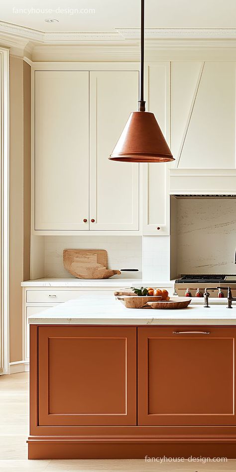 The cabinets in a mushroom color paired with burnt orange tones add a refreshing, coastal vibe to the kitchen. Rust Colour Kitchen, Burnt Orange Kitchen Ideas, Kitchen Paint Color With White Cabinets, Burnt Orange Cabinets, Rust Cabinets, Burnt Orange Kitchen Cabinets, Orange Cabinets Kitchen, Terracotta Cabinets, Rust Kitchen Cabinets