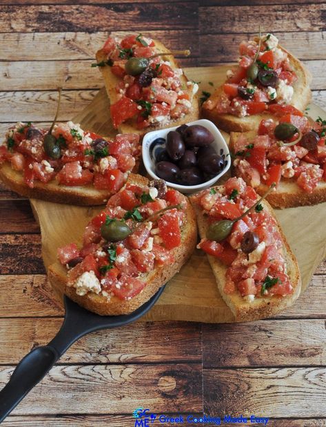 Bruschetta is an antipasto (starter dish) from Italy. This recipe has a Greek twist using Greek olive oil, oregano and feta cheese for a perfect, crunchy lunch or snack/fingerfood! So easy, so quick, so healthy and appetising! #bruschetta #vegetarian #μπρουσκέτα #greekcooking #therecipeoftheday #keepcooking #greece #greek #greekrecipes #hereismyfood #delicious #homecooking #συνταγες #greekcookingmadeeasy #greekyoutuber #greekblogger #ελληνικηκουζινα #mediterraneanstyle #italian_bruschetta Greek Appetizers Parties Food, Greek Starters, Bruschetta Vegetarian, Greek Brunch, Greek Tapas, Vegetarian Antipasto, Greek Bruschetta, Bruschetta Recept, Italian Bruschetta