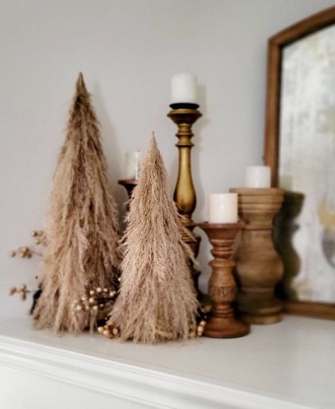 Ring in the holiday season in boho style with these adorable, trendy pampas trees! Made of real dried pampas grass plumes on a sustainable fiber base, these will be the focus of any winter decor. Each tree is made of 4 - 6 large pampas plumes. They're a perfect gift, too! Contact me if you have any questions. These trees are made to order, so don't hesitate to ask if you have questions about customization! They can also be lightly misted with gold glitter 💕  due to box size, these items ship FedEx home delivery and cannot be delivered to PO boxes. If you would like to ship to a PO box, additional shipping charges may apply.  these items are made of genuine dried pampas grass. They have been sprayed with a floral preservative, but they DO SHED. Please take this into account when ordering! Boho Country Christmas Decor, Neutral Boho Christmas Decor, Pampas Grass Decor Christmas, Bohemian Christmas Decor Boho Style, Western Boho Christmas Decor, Christmas Pampas Decor, Rustic Boho Christmas Decor, Boho Christmas Entryway Decor, Boho Pompous Grass Decor