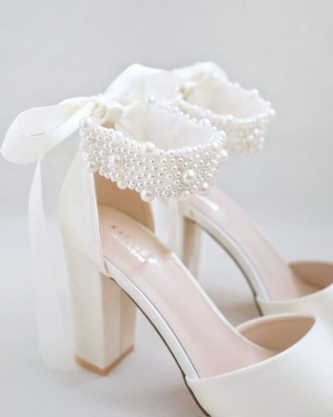 Satin block heel wedding sandals adorned with all over pearls ribbon strap. Elegance and feminine inspired wear for your special day. The delicate pearl beads are placed to create a graceful classic style. Simple and easy wear for bridal wear, bridesmaids, holiday party, wedding parties, and any special occasions.DETAILS:HEELS: 3.75 inchesUPPER: Synthetic upper and liningMATERIALS: Manmade outsoleORIGIN: Imported Wedding Shoes Block Heel, Winter Wedding Shoes, Bride Heels, Pearl Wedding Shoes, Pearl Shoes, Bridal Flats, Wedding Shoes Bride, White Wedding Shoes, Wedding Flats