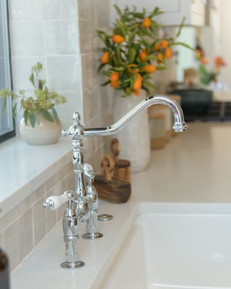 A bridge faucet is the perfect complement to a farmhouse sink.