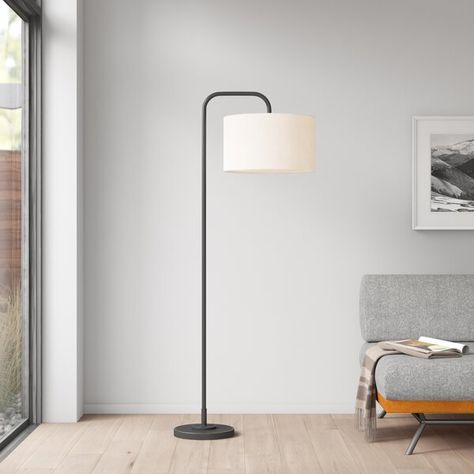 This sleek lamp pairs a streamlined design with retro inspiration and TBH, we're pretty obsessed with it. It's made from metal with a round base and has a straight body that ends in a right-angled arm for a clean look. At the end of the arm, this fixture features a hardback linen drum shade that adds to the retro look. This lamp accommodates a single 100 W bulb (not included). But the best part? It's powered by a footswitch, so you can easily turn it on, even when your hands are full. Black And White Floor Lamp, Floor Lamps Living Room Ideas, Living Room Floor Lamp, Bronze Natural, Floor Lamps Living Room, Arched Floor Lamp, Mid Century Modern Lighting, Contemporary Floor Lamps, Wayfair Furniture