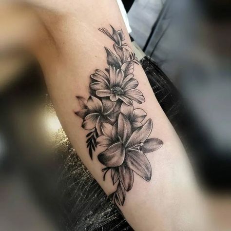 55 Beautiful Lily Flower Tattoo Ideas With Hidden Meaning Simple Lily Tattoo, Lily Shoulder Tattoo, Pink Lotus Tattoo, Lily Flower Tattoo, Lily Of The Valley Tattoo, Tiger Lily Tattoos, Geometric Flower Tattoo, Matching Bff Tattoos, Water Lily Tattoos