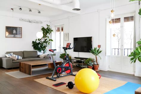 Home Gym Family Room Combo, Family Room Gym Combo, Family Home Gym, Home Gym In Living Room, Style A Tv Console, Treadmill In Living Room, Decorate A Tv Console, Living Room Gym Combo, Gym In Living Room