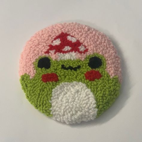 Punch needle coaster, cute animated frog with mushroom on head. Frog Punch Needle, Frog Coaster, Frog Mushroom, Punch Needling, Mug Coaster, Punch Needle Patterns, Needle Crafts, Green Frog, Punch Needle