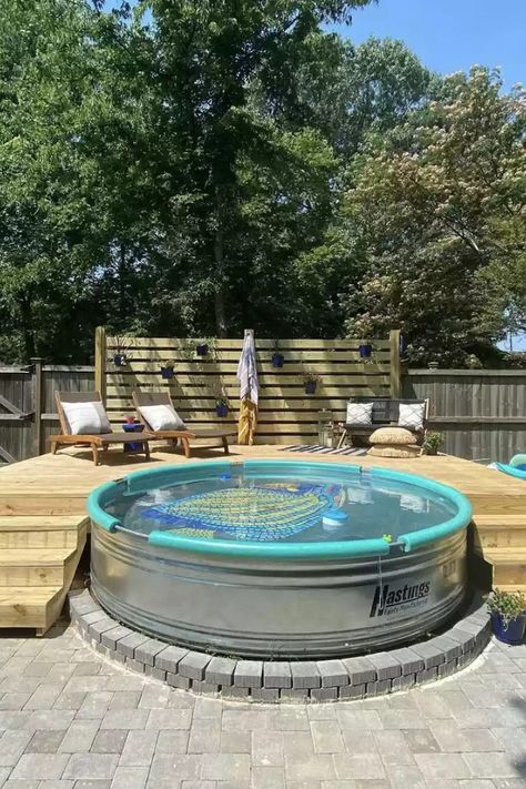 They're known as cowboy pools and trough pools and are seen everywhere! Stock tank pools are replacing more traditional in-ground swimming pools. Enjoy a look at 32 of our favorite stock tank pool designs—along with stock tank tips and how-tos—and get inspired. #StockTankPool #StockTankPoolBackyard #StockTankPoolIdeas #TheSpruce Pool Metal Tub, Small Metal Pools Backyard, Metal Tank Pool, Double Stock Tank Pool, Cowboy Swimming Pool, Water Trough Pool With Deck, Cowboy Pool Deck Ideas, Cowboy Swimming Pools, Metal Trough Pool