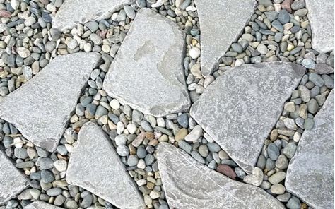 The 15 Most Unique Paver Patio Ideas of 2023 | REthority Patio Ideas With Rocks, Patio Pavers With Gravel, Unique Paver Patio Ideas, Slate Gray Patio Pavers, Pavers And Stones Patio, Large Stones In Landscaping, Unique Paver Designs, Pavers With Pea Gravel Patio Ideas, Paver Stone Ideas