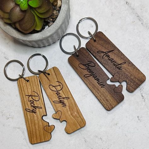 "These beautiful, solid wood keychains make a great gift for a couple.  Perfect for wedding, anniversary, Valentine's Day, or just to show the love between two people.  Keychains are custom cut and laser engraved.  Keychains are 1\" wide by 3\" long, made of 1/4\" solid hardwood.   Please choose type of wood, and add names (double check spelling and capitalization) in the personalization area. Due to the natural variations in wood, they may not appear exactly as shown in the listing photos." Wood Projects For Couples, Laser Engraving Ideas Valentines, Valentines Engraving Ideas, Valentine’s Day Wood Projects, Valentines Day Laser Engraving Ideas, Valentine's Day Laser Cut Gifts, Wood Valentines Gifts, Valentine Laser Ideas, Valentine’s Day Laser Projects