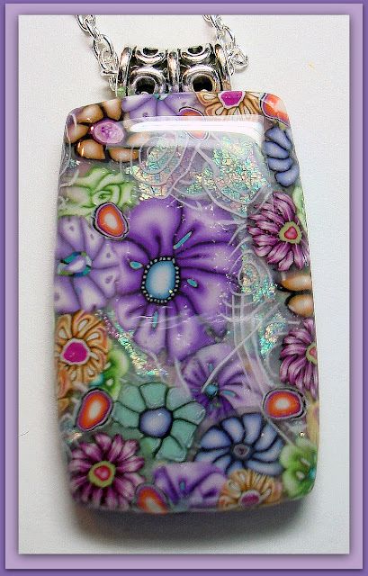 No full tutorial, but artist Sherri Kellberg says she gets this beautiful effect by mixing and layering mille fiore flower canes and using faux dichroic glass techniques. Then she sands the piece and coats with resin. Beadazzle Me Polymer Jewelry: Millifiore Meets Faux Dichroic Glass Fimo, Diy Fimo, Polymer Flowers, Gray Flower, Polymer Inspiration, Polymer Beads, Beaded Beads, Polymer Clay Canes, Polymer Crafts