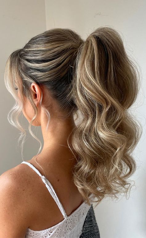 textured ponytail, ponytail bridal style, ponytail hairstyle, voluminous bridal ponytail, chic ponytail High Ponytail Hairstyles For Hoco, Homecoming Updos Ponytail, Updos For Medium Length Hair Ponytail, Hoco Updos Ponytail, Formal Hair Updo Ponytail, Cute Updos For Bridesmaids, Ponytail Updo For Wedding, Prom Updo Ponytail, Homecoming Hairstyles High Ponytail