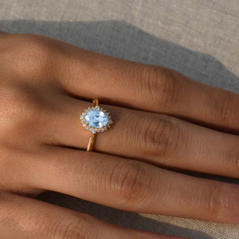 "Aquamarine Vintage Engagement Ring/Aquamarine Ring With Diamond Halo/14k Solid Yellow Gold/Natural Oval Aquamarine/March Birthstone Jewelry ★ ★ ★ ★ CUSTOM/DUTY-FREE SHIPPING WORLDWIDE, BUYERS DON'T HAVE TO PAY ANY CUSTOM FEES WHILE IMPORTING ★ ★ ★ ★ Details Made to order Material: 14k/18k gold Color Options: Yellow Gold, White Gold, Rose Gold ★ Center Stone Aquamarine, Oval Cut Size: 5X7 mm Approx Weight (Ct): 0.96 ★ Accent Stones Diamond Round Size: 1.1 mm * 12 No.s , 1.5 mm * 4 Nos. Approx We Diamond Aquamarine Engagement Ring, Engagement Ring With Aquamarine Accents, Diamond Aquamarine Ring, Aquamarine And Gold Engagement Ring, Light Blue Diamond Engagement Ring, Light Blue Stone Engagement Ring, Aquamarine Oval Engagement Ring, Vintage Aquamarine Engagement Ring, Aquamarine Halo Engagement Ring