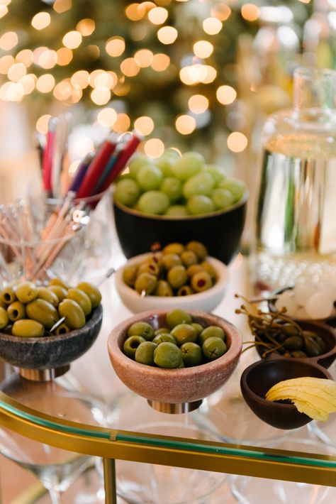 How to Set Up a Holiday Party Martini Bar - Front + Main Holiday Bar Set Up, Holiday Party Bar Set Up, Martini Night Party, Martini Party Appetizers, Make Your Own Martini Bar Party Ideas, Cocktail Bar Set Up For Party, Diy Martini Glasses, New Years Cocktail Party, Small Cocktail Party Ideas