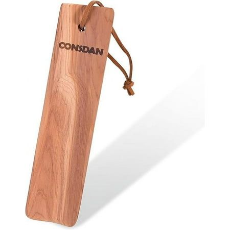 This compact, USA-made cedar shoe horn is perfect for travel and daily use. Crafted from solid cedar, it's durable, comfortable, and naturally odor-neutralizing. Each piece features a unique wood grain, combining elegance with practicality. Size: 6" L. Horn, Wood Shoe, Wood Shoes, Shoe Horn, Travel Shoes, Cedar Wood, Wood Grain, Grain, Size 6