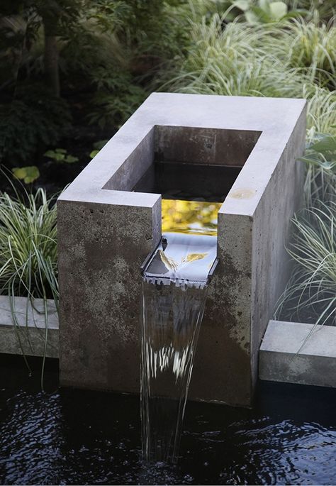 The landscape architects designed an integrated fountain of concrete and bronze for the water feature, “for its soothing sound as well as a focal point,” said Wittman. Most of the new windows are operable so the sound of water can be heard from inside the house. Backyard Water Fountains, Water Fountain Design, Kolam Koi, Taman Air, Air Mancur, Pinterest Garden, Fountains Backyard, Ikan Koi, Desain Lanskap