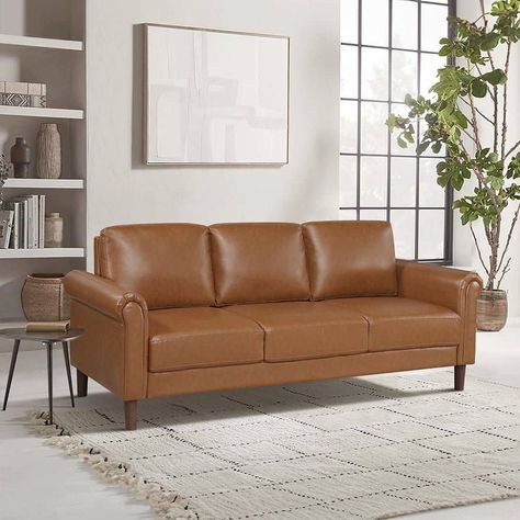 Classic rolled arms are paired with subtle mid-century inspired lines to create the Walterboro Collection. Brown faux leather upholstery covers the sofa, love seat, and chair. Faux wood legs support the seating collection. Leg Support, Faux Wood, Interior Furniture, Leather Upholstery, Wood Legs, Love Seat, Living Room Furniture, House Interior, Upholstery