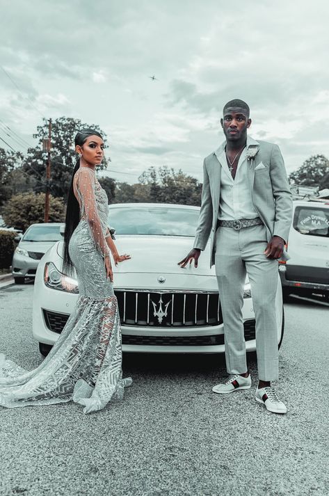 Prom 2023 Black Couples, Grey Prom Dress Couple, Black And Silver Prom Suits For Guys, Silver Suit For Men Prom, Silver Prom Outfits For Couples, Prom 2k23 Black Couple, Prom Couples Silver, Silver And Black Prom Suit, Black Couples Homecoming Outfits