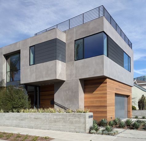 Modern home with Exterior, House, Flat RoofLine, Wood Siding Material, Metal Siding Material, and Stucco Siding Material. Front Corner View Photo 2 of Oxford Residence House Concrete Exterior, Concrete And Wood House Exterior, Stucco Homes Modern, Cement Homes Exterior, Modern Exterior Materials, Modern Stucco House Exterior, Concrete Siding Exterior House, Stucco And Wood Exterior, Stucco Exterior Colors Modern