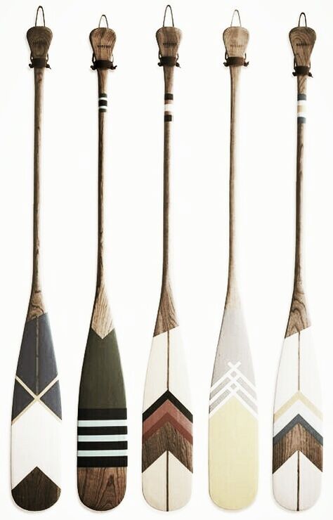 Oars On Wall Decor Ideas Living Room, Paddles On Wall Decor, Boat Ore Decor Ideas, Decorating With Oars Paddles, Hanging Boat Oars On Wall, Canoe Paddle Designs, Decorating With Oars, Painted Oars Paddles Wall Art, Painted Boat Oars