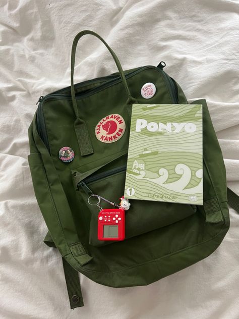 Anime Backpack Aesthetic, Green Kanken Aesthetic, Studio Ghibli Backpack, Ponyo Aesthetic Outfit, Aesthetic Backpack Pins, Cute Backpack Pins, Backpack Inspo Aesthetic, Anime Pins On Backpack, Green Backpack Aesthetic