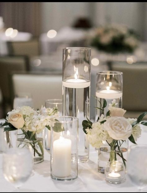 Candle In Glass Vase Decor Wedding, 3 Candle Centerpiece, Reception Centerpieces With Candles, Candle And White Flower Centerpiece, Candle Floral Centerpieces, Candles On Table Wedding, Candle Centrepiece For Wedding, White Table Centerpiece Ideas, Wedding Floating Candle Centerpieces