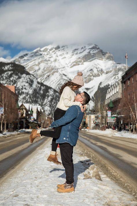 Banff Winter Engagement at Lake Minnewanka - Banff Engagement Photographer  via Kim Payant Photography, Cozy Winter Engagement Session Ideas - Banff  Engagement Photographer, Engagement Poses ideas, Where to take engagement photos, winter mountain Engagement, Downtown Banff Winter Engagement Session - Mountain Village Photo Session  #banffwinterengagement #banffengagementphotographer #cozyengagementphotos Banff Engagement Photos Winter, Engagement Photos Banff, Banff Family Photos, Banff Couple Photos, Banff Engagement Photos, Banff Town, Banff Engagement, Banff Winter, Winter Honeymoon