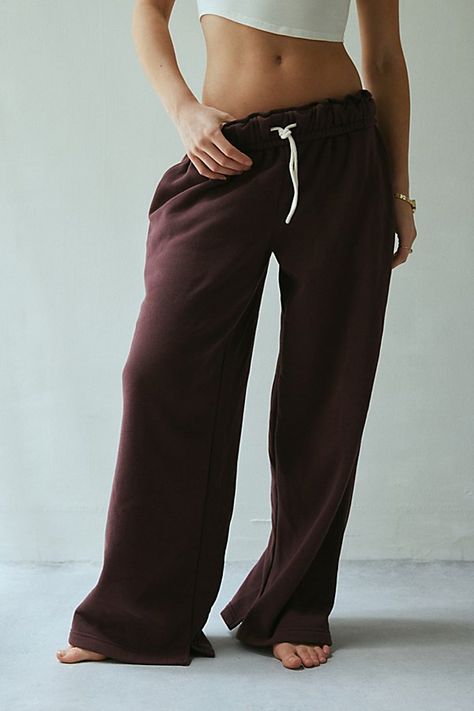 Out From Under sweatpant made special with piping details. Designed in a relaxed wide-leg silhouette featuring a ruffled elastic waistband with drawstring tie, side pockets and split hems. Exclusively at Urban Outfitters. Features Out From Under Hoxton piping wide leg sweatpant Wide leg sweatpant Soft and stretchy knit Ruffled elastic waistline with drawstring tie Side pockets with contrast piping down the sides Split hems Relaxed wide-leg fit Full length Easy pull-on style UO exclusive Content Gifts For Boyfriend Clothes, Proclub Sweats, Staple Clothing Pieces, Cool Sweatpants, Clothes To Buy, Brown Sweatpants, Fall Bottoms, Cute Online Clothing Stores, Cute Sweatpants